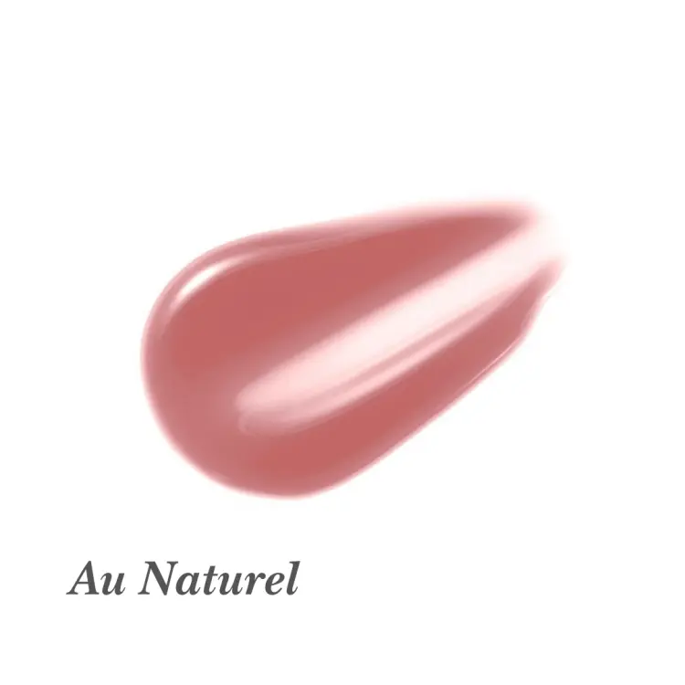 Na przedstawionym zdjęciu znajduje się błyszczyk do ust Jane Iredale w odcieniu Au Naturel. Au Naturel to delikatny, ciepły odcień nude z nutą różu.  Daje naturalny, subtelny efekt z połyskiem – idealny na co dzień.