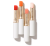 Na zdjęciu widoczne są cztery pomadki z kolekcji Just Kissed Lip and Cheek Stain marki Jane Iredale. Produkty umieszczone są w eleganckich, białych opakowaniach ze złotym wykończeniem.  Każda pomadka ma inny odcień