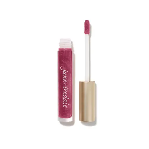 Na zdjęciu znajduje się błyszczyk do ust marki Jane Iredale w odcieniu Candied Rose. Kolor to intensywny róż z nutą śliwki, wzbogacony połyskującymi drobinkami, które nadają ustom efekt mokrego blasku i głębi.