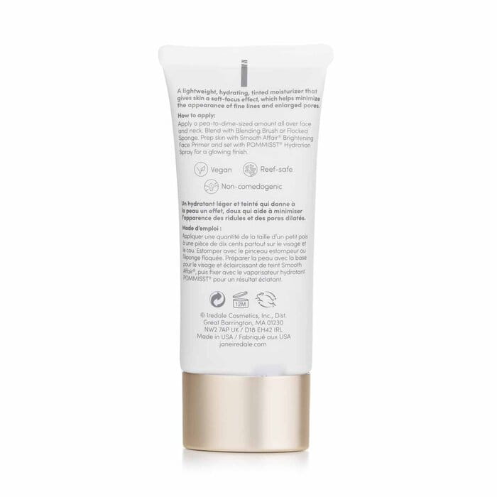 Tył opakowania JANE IREDALE Dream Tint Tinted Moisturizer to elegancka tubka z miękkiego plastiku w kolorze beżowym, z delikatnymi złotymi akcentami. Ma praktyczny otwór dozujący, umożliwiający łatwą aplikację. Pojemność to 40 ml.