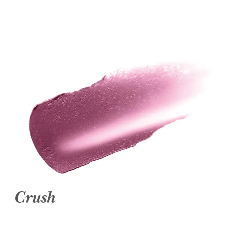 Na grafice widoczna jest próbka koloru szminki lub balsamu do ust marki Jane Iredale w odcieniu Crush. To chłodny, głęboki róż wpadający w śliwkę, z subtelnym połyskiem. Konsystencja wygląda na kremową i gładką
