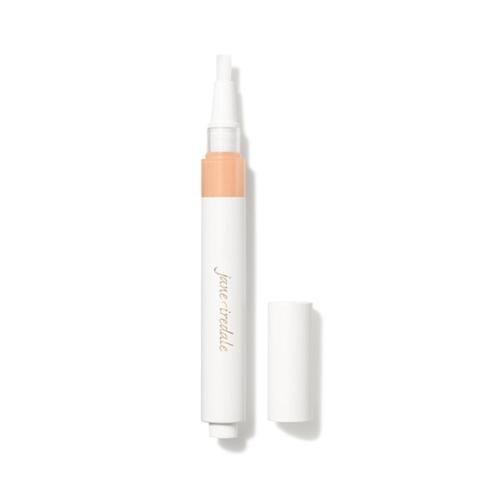Na zdjęciu znajduje się korektor w pędzelku marki jane iredale – Skintuition Brightening Under Eye Concealer. Widać opakowanie typu twist z wbudowanym aplikatorem-pędzelkiem oraz zatyczkę. Produkt służy do rozświetlania i maskowania cieni pod oczami.